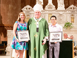 Archbishop Joseph W. Tobin poses for a photo with Brie Anne Eichhorn and Cory Watkins, the recipients of the archdiocese’s 2016 Young Adult Servant Leader of the Year Award. The awards were presented during a Mass at SS. Peter and Paul Cathedral in Indianapolis on Sept. 25. (Submitted photo by Allie Tyler)