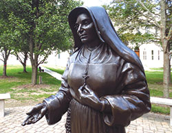 A statue of St. Mother Theodore Guérin graces the courtyard of the Sisters of Providence of St. Mary-of-the-Woods, Ind. on Oct. 6. The sisters celebrated the 10th anniversary of their congregation’s foundress on Oct. 15. (CNS photos/Katie Breidenbach)