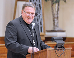 Cardinal-designate Joseph W. Tobin shares a laugh during his comments at the Miter Society Reception at the Archbishop Edward T. O’Meara Catholic Center in Indianapolis on Oct. 18. On Nov. 7, he was named to lead the Archdiocese of Newark, N.J. (Criterion photo by Natalie Hoefer)
