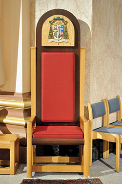 The cathedra, the ceremonial seat of the archbishop of Indianapolis, sits empty in SS. Peter and Paul Cathedral in Indianapolis on Nov. 8, the day after Cardinal-designate Joseph W. Tobin was announced as the new archbishop of Newark, N.J. While the cathedra will remain unused until the appointment of a new archbishop of Indianapolis, the Church’s Code of Canon Law provides for the steady day-to-day governance of the Church in central and southern Indiana in the interim. (Photo by Sean Gallagher)