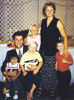 Robert Rogers is pictured with his family hours before a flash flood on Aug. 30, 2003, resulted in the death of his wife Melissa and their four children. Robert is shown holding Alenah, 1, and Zachary, 5. Melissa has her arms around Makenah, 8, and Nicholas, 3. (Photo courtesy Robert Rogers)