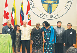 During the inaugural archdiocesan Intercultural Ministry Awards Dinner on Nov. 15, 2014, the members of the Committee of Intercultural Ministry Coordinators at that time gather for a photo. They are Franciscan Brother Moises Gutierrez, former Intercultural Ministry director, left; Myanmar/Burmese Ministry coordinator Rita Si Si Lwin; Divine Word Missionaries Father Sam Cunningham, former Hispanic Ministry coordinator; Franciscan Sister Jeannette Pruitt, former Black Catholic Ministry coordinator; former French-speaking Ministry coordinator Dabrice Bartet; former Philippine Ministry coordinator Marlon Alfonso; and Vietnamese Ministry coordinator Father Minh Duong. (Photo by Natalie Hoefer) 