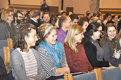 Young adults laugh at a humorous comment made by guest speaker Ennie Hickman at the Vigil for Life at SS. Peter and Paul Cathedral on Jan. 25. (Photo by Natalie Hoefer)