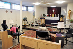 Two women pray in adoration of the Blessed Sacrament on March 6 in the Divine Mercy Chapel at St. Michael the Archangel Parish in Indianapolis. Established in 1989, the chapel was the first parish-based perpetual adoration chapel in the Archdiocese of Indianapolis. Twelve others have subsequently been started. (Photo by Sean Gallagher)