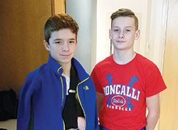 When Drew Willis, left, and John Troxell wrestled each other in a Catholic Youth Organization match on March 4, the two Catholic grade-school students didn’t expect that their competition would become a touching lesson about friendship. (Submitted photo)