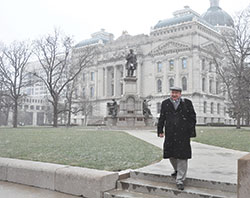 Snow falls as Glenn Tebbe, executive director of the Indiana Catholic Conference, leaves the Indiana Statehouse after a day representing the voice of the Indiana Catholic bishops during the General Assembly on Feb. 8. (Photo by Natalie Hoefer)
