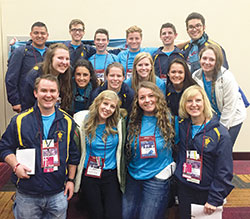 Scott Williams, bottom row left, new director of youth ministry for the archdiocese, is pictured with members of the Archdiocesan Youth Council at the National Catholic Youth Conference in Indianapolis in November 2015. Also pictured to the far right in the bottom row is Kay Scoville, former archdiocesan director of youth ministry, who Williams is succeeding. (Submitted photo)