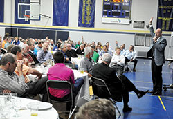 Author and speaker Glenn Bill, a member of Christ the King Parish in Indianapolis, gives a presentation on attitude on May 17 at St. Luke the Evangelist Parish in Indianapolis during the seventh annual St. Joseph’s Men Valuing Prayer and Service Steak Dinner. The event, sponsored by the ministry at St. Luke that supports men in their faith, drew more than 200 attendees from across the Indianapolis North Deanery and beyond. (Photo by Sean Gallagher)