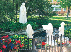 The 2010 Fatima Grotto, on the grounds of the shrine, is dedicated to the sanctification of Catholic families and the protection of children. (Photo by Elizabeth Granger)