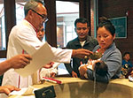 Bishop baptizing child