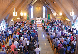 More than 500 Catholics worship with Archbishop Charles C. Thompson at Our Lady of Perpetual Help Church in New Albany on July 30 during his first Mass in an archdiocesan parish. (Photo by Natalie Hoefer)