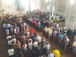 A congregation of about 300, including 136 youths of the New Albany Deanery bound for the National Catholic Youth Conference (NCYC) in Indianapolis in November, worship during a special Mass at St. Augustine Church in Jeffersonville on Aug. 13. Following the Mass, they attended a breakfast hosted by Knights of Columbus Council 1348, who donated $100 to each of the youths to help them attend NCYC. (Submitted photo)