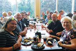Several parish catechetical leaders from across central and southern Indiana share a meal together during the St. John Bosco Conference held on July 17-20 at Franciscan University of Steubenville in Steubenville, Ohio. Included among them were three priests serving in the archdiocese. (Submitted photo)