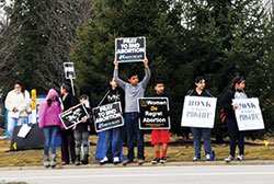 Participants in a 40 Days for Life campaign midpoint rally hold pro-life signs in front of the Planned Parenthood abortion facility in Indianapolis on March 14, 2015. (File photo by Natalie Hoefer)