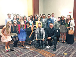 Father Rick Nagel, front row, right, poses with a group of young adults from his parish, St. John the Evangelist in Indianapolis, and students from Indiana University-Purdue University Indianapolis at the Right to Life of Indianapolis annual “Celebrate Life Dinner” on Oct. 3. (Submitted photo by Jacob Day)