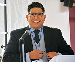 Saul Llacsa, new archdiocesan coordinator for Hispanic ministry, smiles before offering the opening words at the archdiocesan V Encuentro event at St. Andrew the Apostle Parish on Sept. 30. He started in the role in July. (Photo by Natalie Hoefer)