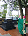 Archbishop blessing statue