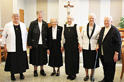 Benedictine Sisters Mary Agnes Sermersheim, left, Corda Trouy, Sylvia Gehlhausen and Jan Youart, each of whom have ties to the archdiocese, smile with Sisters Mary Ann Schepers and Christine Kempf on Oct. 29 as the six sisters of Monastery Immaculate Conception in Ferdinand, in the Evansville Diocese, celebrated special anniversaries of profession of their vows. (Submitted photo)