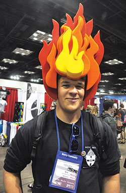 NCYC participant Nick Nachreiner of the Diocese of Winona, Minn., wears his sporty headgear in the Indiana Catholic Convention Center on Nov. 16. (Photo by Sean Gallagher)
