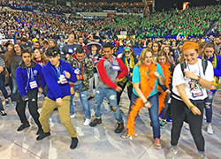 National Catholic Youth Conference participants do a line dance after the closing Mass at Lucas Oil Stadium in Indianapolis on Nov. 18. (Photo by Natalie Hoefer)