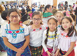 Central Catholic School students Ingrid Reyes, left, Yasmin Salazar, Lesly Reyes, Stephanie Jasso and Natalia Jasso dress festively for the celebration of Our Lady of Guadalupe on Dec. 12, 2017, at their Indianapolis school. (Submitted photo)