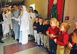 Students of St. Bartholomew School in Columbus participate in a Las Posadas procession on Dec. 18, 2017. The procession is a traditional Mexican Advent celebration that re-enacts Mary’s and Joseph’s search for a room in Bethlehem, and commemorates the nine months during which Mary carried Jesus in her womb. The procession is just one way in which the school, a member of the archdiocese’s new Latino Outreach Initiative, is seeking to invite and support their Latino students and families. (Submitted photo)