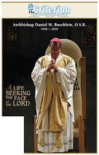 Archbishop Daniel M. Buechlein prays silently during the petitions at a Mass on Aug. 29, 2002, at SS. Peter and Paul Cathedral in Indianapolis. The event celebrated his 10th anniversary as the archbishop of Indianapolis. (File photo by Brandon A. Evans)