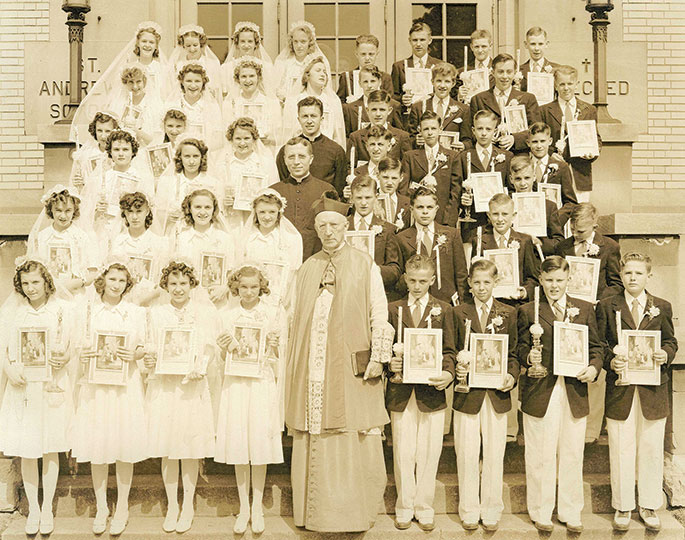 This photo was taken of the solemn Communion class at the former St. Andrew Parish in Richmond on May 31, 1942. In 1910, Pope St. Pius X published a decree stating that children should receive their first Communion once they had attained the age of reason, usually around age 7. Prior to that time, it was customary for children to receive their first Communion at an older age.