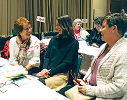 Joanna Kinker, left, of St. Nicholas Parish in Sunman, shares a lighthearted moment with daughters Beth Enneking, middle, of St. Louis Parish in Batesville, and Jona Dierckman, also of St. Nicholas Parish. The family members were awaiting the next speaker at the 13th annual Indiana Catholic Women’s Conference. (Photo by Victoria Arthur)