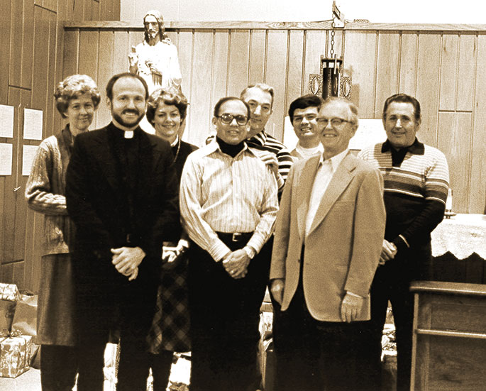 Gathered for this Jan. 6, 1983, photo are members of Most Sacred Heart of Jesus Parish in Jeffersonville. In the front row are Father Wilfred “Sonny” Day, left, Albert Jones, president of the parish council and Henry Striby. In the back row are Pauline Bourne, left, Judy Butcher, principal of the parish’s school, Paul Semones, Bob Hickey, director of religious education, and Charles Bernhart. Sacred Heart School was unique in the diocese for the presence of Dominican sisters. At the time of this photograph, three sisters taught in the school, two were retired, and three were residents in the parish. Sacred Heart Parish was founded in 1953.