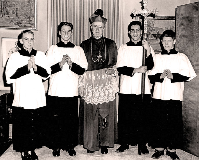 Following a confirmation liturgy, Archbishop Paul C. Schulte posed for a photograph with altar servers at St. Paul the Apostle Parish in Greencastle on March 2, 1959. From left to right in the photo are Pat Harrold, left, Bobby Tennis, Archbishop Schulte, Fleck Conrad and Paul Harrold. This photo originally appeared in the Putnam County Graphic newspaper.