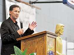Professional race car driver John Andretti stands at the Indianapolis Motor Speedway in 2009 in Indianapolis on the opening day of practice for the 93rd running of the Indianapolis 500. Andretti recently spoke at St. Luke the Evangelist Parish in Indianapolis about the role his Catholic faith has played in his struggle with colon cancer since January 2017. (Submitted photo)