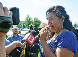 Erika Fierro speaks with members of the press after her May 31 meeting with Intensive Supervision Appearance Program officials in Indianapolis. She was expecting to be deported to Mexico during the meeting, but was instead given a removal date of June 26. That date, she says, is still too early for her two children’s passports to be issued. (Photo by Natalie Hoefer)