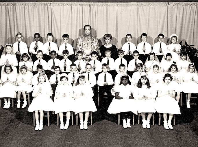 This photo depicts the first Communion class at St. Andrew the Apostle Parish School in Indianapolis in 1967. St. Andrew the Apostle Parish was founded in 1946, and the school was dedicated in 1948. Father Richard Mode, seen in the photo, served as pastor of the parish from 1966-1971. To view additional first communion photos, check out the weekly “First Communion Friday” feature on the archdiocesan archives Facebook page at: www.facebook.com/archindyarchives.