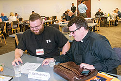 Fathers Douglas Marcotte, left, and James Brockmeier were among the representatives from the archdiocese who participated in the recent first meeting of the parishes chosen for the Young Adult Initiative, a multi-parish, multi-state effort to connect young adults and the Church. The meeting was held in May at Saint Meinrad Seminary and School of Theology in St. Meinrad. (Submitted photo)