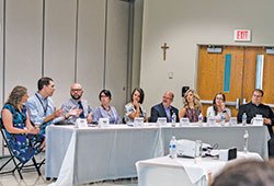 A medical panel discusses sexuality and fertility on June 16 as part of the One in Christ marriage preparation program. The panelists are Julie and Matt Miller, left, Dr. Konrad Szymanski and his wife Sonia-Maria, Marianne Stroud and her husband Dr. Christopher Stroud, Dr. Casey Delcoco, Dr. Holly Smith and Father C. Ryan McCarthy. (Photo by Kelly Martin Photography)
