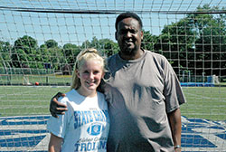 Inspired by the life and commitment to forgiveness of Kizito Kalima, right, a survivor of the 1994 genocide in Rwanda, 16-year-old Olivia Julian held a soccer clinic at Bishop Chatard High School in Indianapolis on June 29 for youths and children who were born in the refugee camps of that African country. (Photo by John Shaughnessy)