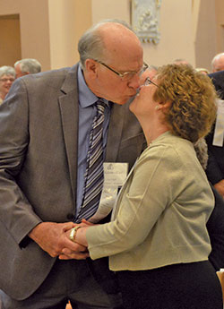 Malcolm and Charlene Ettel of St. Mary Parish in Lanesville share a kiss during the archdiocesan Golden Wedding Jubilee Mass at SS. Peter and Paul Cathedral in Indianapolis on Aug. 5. (Photo by Natalie Hoefer)
