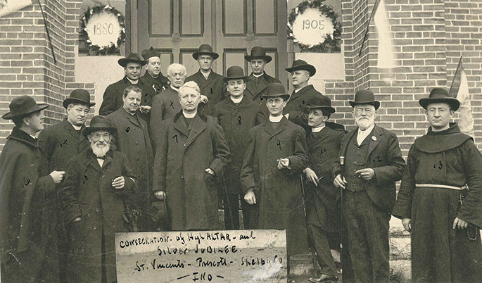 In 1905, St. Vincent de Paul Parish in Shelby County, which was founded in 1837, celebrated the silver jubilee of its church building, which was constructed in 1880. This photo from the occasion features several priests and two lay Catholics who gathered for the celebration. Father Joseph Bauer, who was pastor of the parish in 1905, appears at left in the front row. Standing in the first row, second from right, is Nicholas Weintraut, great-grandfather of Omer Weintraut, who is featured in an article that begins on page 1 of this issue. The church was destroyed by a fire on April 4, 1924. The cornerstone for a new church building was laid within the same year. 
