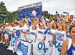 Students at Bishop Chatard High School in Indianapolis cheer on their Trojan football team on Aug. 17, the night of the first true “home” football game at the school—a 38-7 win over the team from Brebeuf Jesuit Preparatory School in Indianapolis. (Photo courtesy of Banayote Photography) 