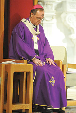 Archbishop Charles C. Thompson of Indianapolis prays during Ash Wednesday Mass on Feb. 14 at SS. Peter and Paul Cathedral in Indianapolis. The archbishop will gather in solidarity to pray for victims of sexual abuse and their families during a Holy Hour for Prayer, Penance and Healing at 11 a.m. on Sept. 15 at the cathedral. (File photo by Sean Gallagher)