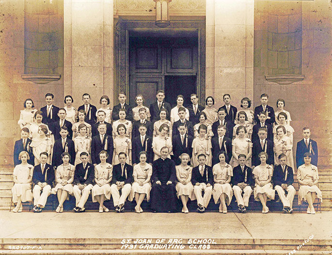 This photo depicts the eighth-grade graduating class of St. Joan of Arc School in Indianapolis in 1931. Shown in the center of the front row is Father Maurice O’Connor, who served as pastor of the parish from 1924-1939. St. Joan of Arc Parish was formed in 1921, and the school opened in January 1922. These graduates were the second class to complete all years of their elementary education at St. Joan of Arc School.