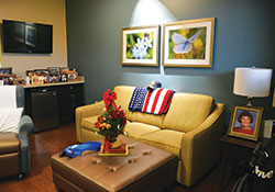 Comfortable rooms decorated with family photos and meaningful mementos—such as this room of a war veteran at Franciscan Hospice House in Indianapolis—are typical of hospice care homes. Hospice care, which falls under the umbrella of palliative care, seeks to help terminally ill patients live out their final days in comfort and peace. (Photo by Natalie Hoefer)