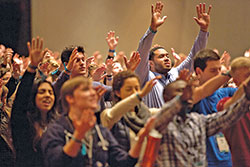 Young adults raise their hands in prayer during the Fellowship of Catholic University Students’ SEEK conference held on Jan. 3-7, 2017, in San Antonio, Texas. (Photo courtesy of Fellowship of Catholic University Students)
