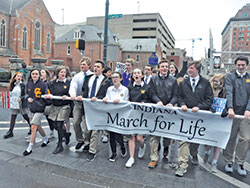 Youths carry a banner at the front of the inaugural Indiana March for Life in Indianapolis on Jan. 22, 2018. (File photo by Natalie Hoefer)