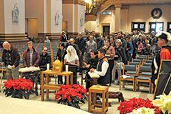 People stand in line on Jan. 4 in SS. Peter and Paul Cathedral in Indianapolis, waiting to venerate the incorrupt heart of St. John Vianney, a French priest who died in 1859 and is the patron saint of parish priests. (Photo by Sean Gallagher)
