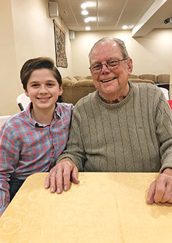 Eli Aldrich, left, shares more than a winning smile with his great-grandfather, Paul Hornberger. They are also part of their family’s amazing streak of Catholic education. (Submitted photo)