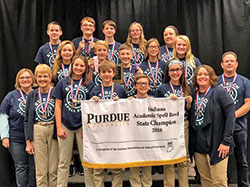Students and coaches of the Spell Bowl team of St. Roch School in Indianapolis pose for a photo after winning the Indiana state championship in spelling at the Class 4 level, marking the sixth time in the past seven years that the school’s team has won a state championship. (Submitted photo)