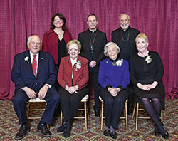An archdiocesan celebration of Catholic education on Feb. 7 honored a married couple and two individuals whose Catholic values mark their lives. Sitting, from left, are honorees Jerry and Rosie Semler, Virginia Marten and Pat Musgrave. Standing, from left, are archdiocesan superintendent of Catholic schools Gina Fleming, Archbishop Charles C. Thompson and keynote speaker Bishop Gerald F. Kicanas. (Submitted photo by Rob Banayote)