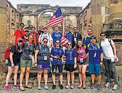 Members of the archdiocesan group that traveled to World Youth Day in Panama pause for a photo amid the ruins of a Jesuit church in Panama City, a church that burned down in the mid-18th century and was never rebuilt. (Submitted photo)